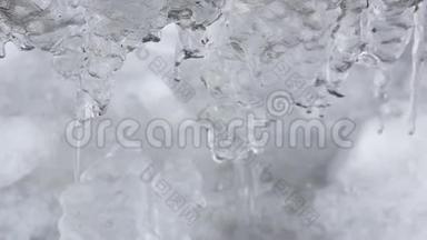 冬季或春季背景冰柱结冰，滴水，融水，冰圈